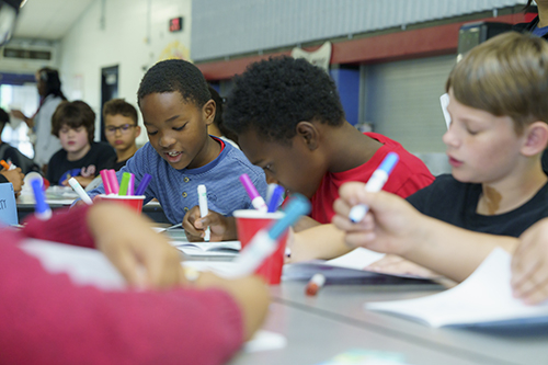 Children doing a table activity together