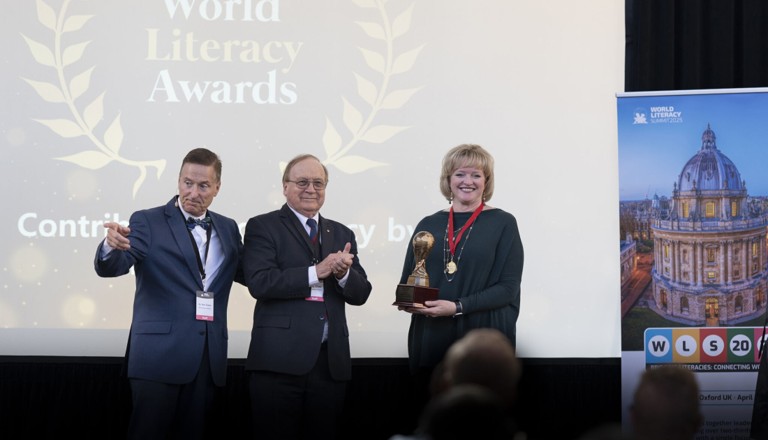 RIF CEO Alicia Levi accepting an award on stage