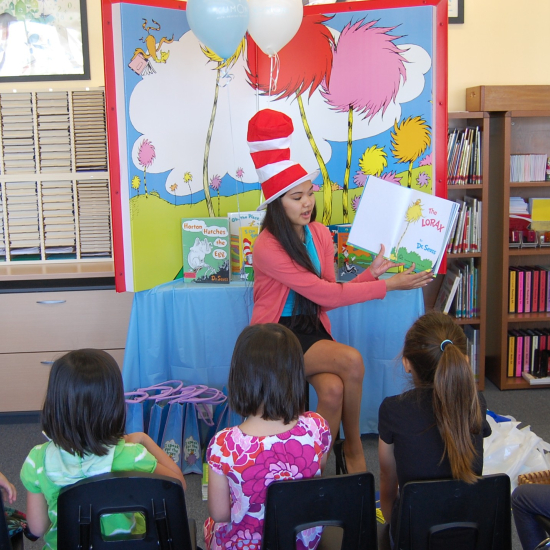 Read aloud Dr. Seuss books with teacher and students