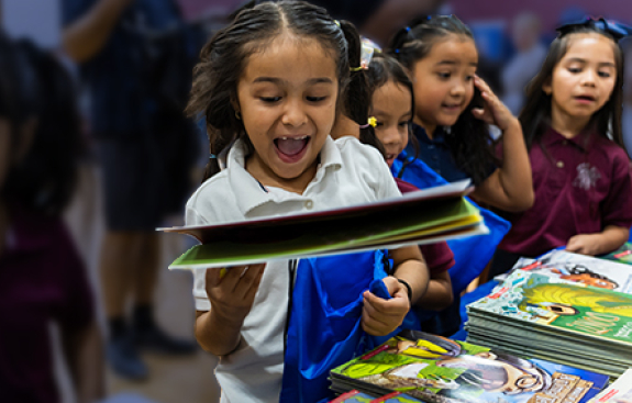 girls joyful at a book celebration