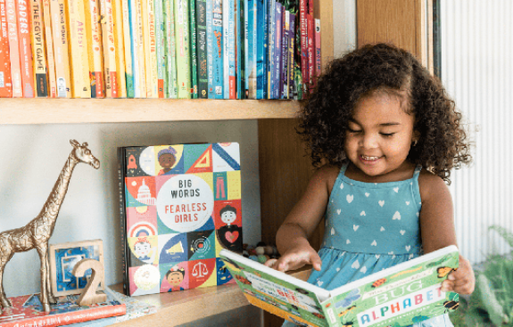 child happily reading a book