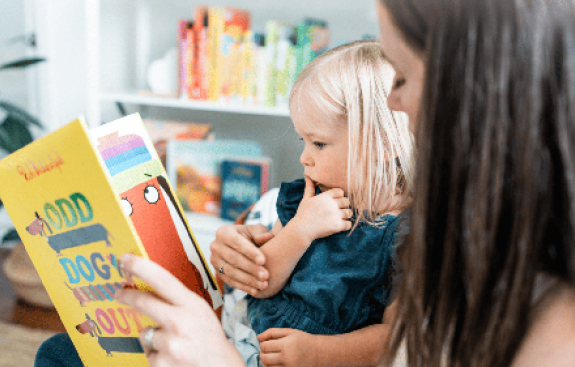 child with mother reading together