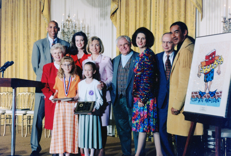 Front row, L to R: RIF President Ruth Graves, National RIF Reader Megan O'Malley, National Poster Contest Winner Laura Lawson. Back row, L to R: NBA star Reggie Miller, Miss America Tara Holland, First Lady Hillary Rodham Clinton, author/illustrator Tomie de Paola, RIF Chair Lynda Johnson Robb, U.S. Secretary of Education Richard W. Riley, and actor Larry Sellers.