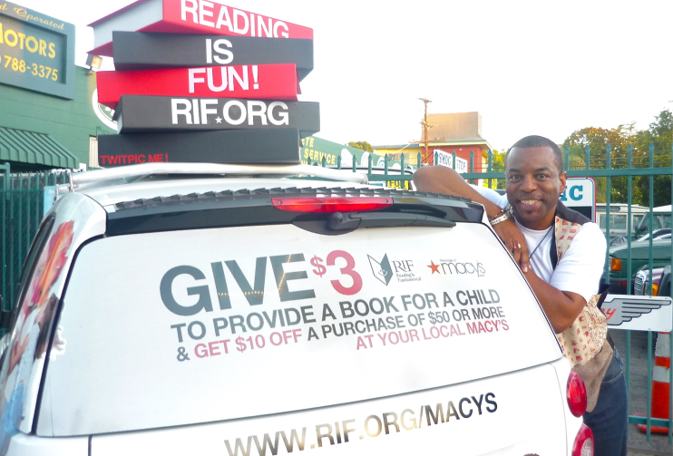 In 2011, LeVar Burton poses with the smart car promoting the RIF-Macy's Be Book Smart campaign.